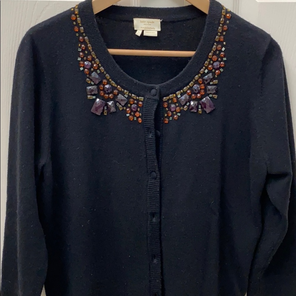 Kate spreads jeweled sweater
